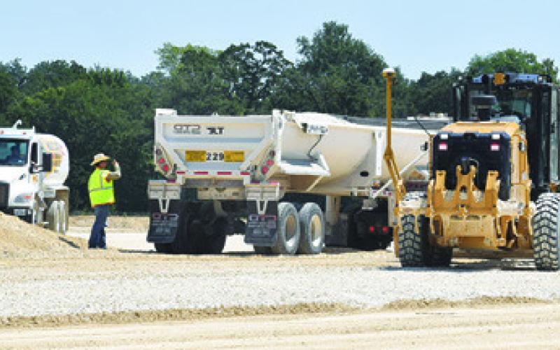 AN LCRA CREW does the dirt work on Monday, Sept. 8, at the site of Caldwell’s new substation. Tribune photo by Roy Sanders