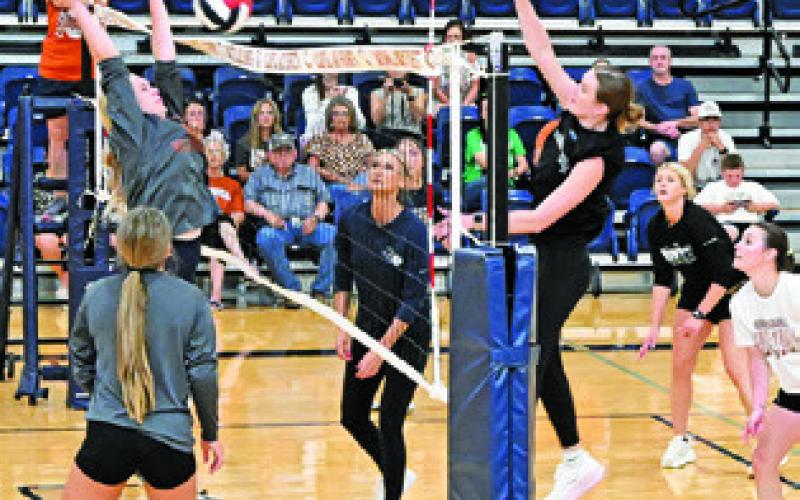 THE CALDWELL ALUMNI TEAM gave the Lady Hornets a tough fight during Saturday’s alumni scrimmage -- though the current team won. Tribune photo by Denise Squier