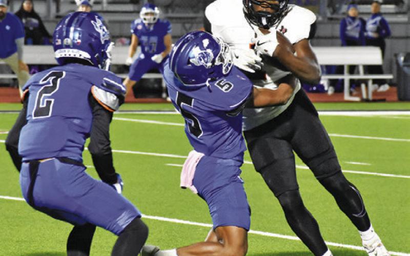 Tribune photo by Roy Sanders KEITH CRAWFORD OF Somerville carries the ball against Ben Bolt.