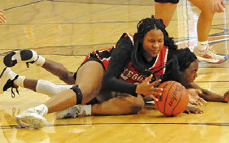 KEIRA MOORE fights for possession of the ball during Somerville’s game against Lexington at the Lady Hornet Classic Basketball Tournament last week in Caldwell. Tribune photo by Denise Squier