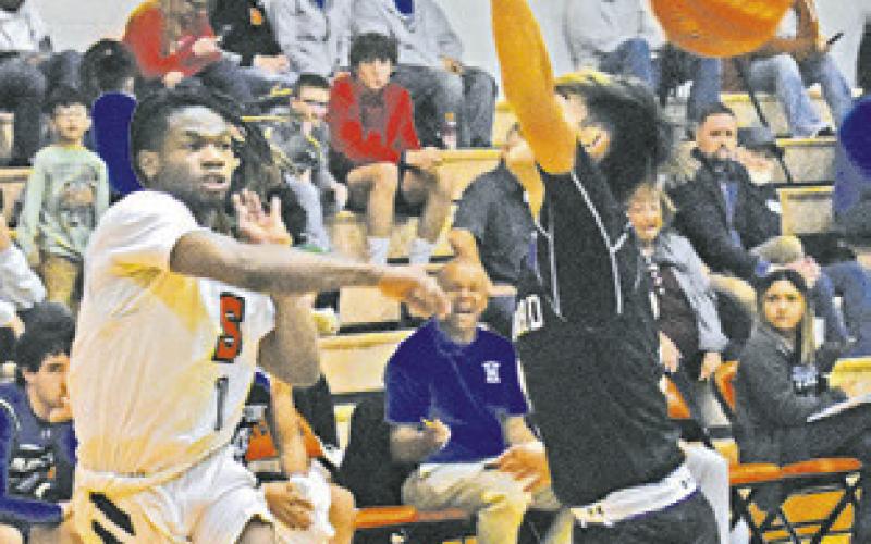 HERSCHEL CONWAY of Somerville hurls this pass last Friday against Mumford.