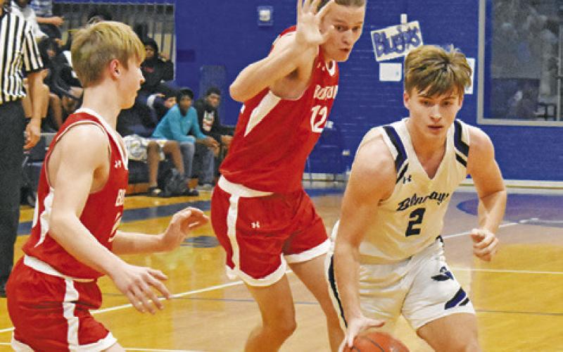 SAM SMITHERMAN MOVES in for a shot last Friday against Burton in Snook. The Bluejays won 54-32. Tribune photo by Roy Sanders