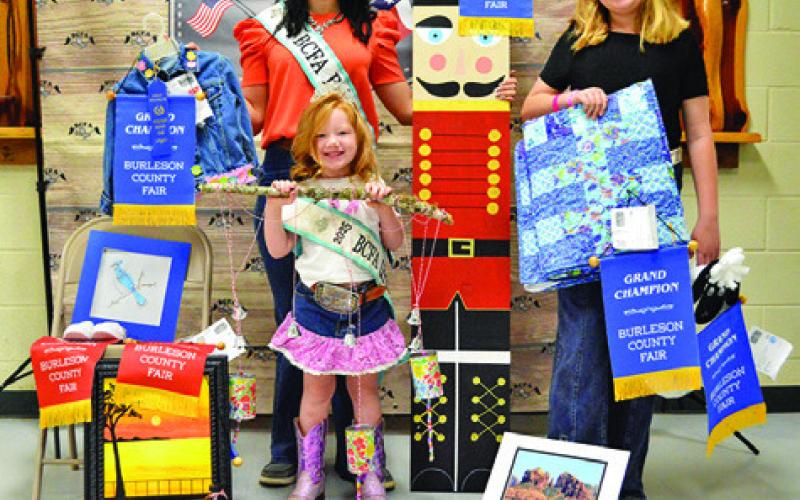 BAILEY ANDERSON WON GRAND IN Junior Art, Creative Arts and Crafts and Quilts. Also pictured are Fair Queen Kodi Hitchcock and Little Miss Taytum Hohlt. Tribune photo by Sabine Lazo