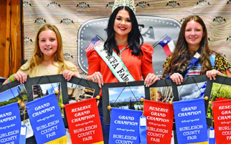 HEIDI AND HATTIE HERMANN WON grands in Junior Photography and Creative Arts. They are pictured with Fair Queen Kodi Hitchcock. Tribune photo by Sabine Lazo