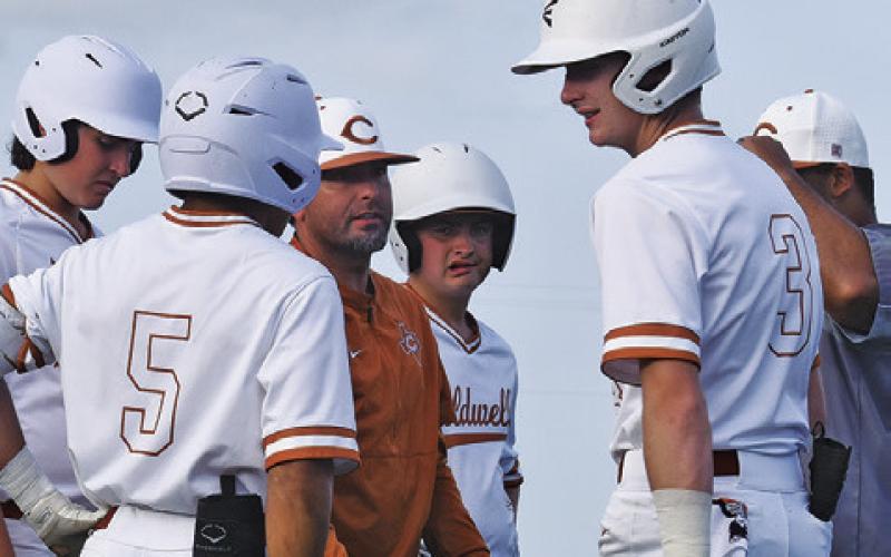 CALDWELL HEAD COACH Kyle Toney talks to his team between innings of a recent game. -- Tribune photo by Roy Sanders