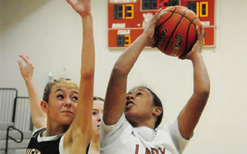 AVA JONES TRIES to get off a shot during the Caldwell-Bruceville-Eddy game last Monday. -- Tribune photo by Denise Squier