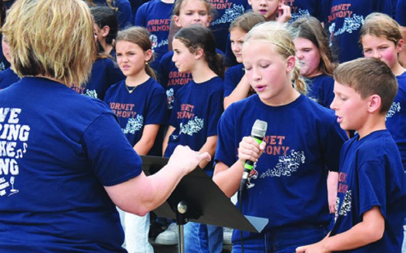 CALDWELL INTERMEDIATE SCHOOL choir students sing on Thursday, May 1, at National Day of Prayer at the county courthouse. Tribune photo by Roy Sanders