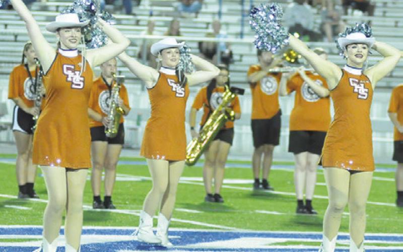 CALDWELL HIGH SCHOOL Honeybees, Captain Ava Gordon, Natalie Buckholt and First Lieutenant Kodi Hitchcock, perform a dance routine during the Caldwell-Robinson football game on Friday. Tribune photo by Denise Squier