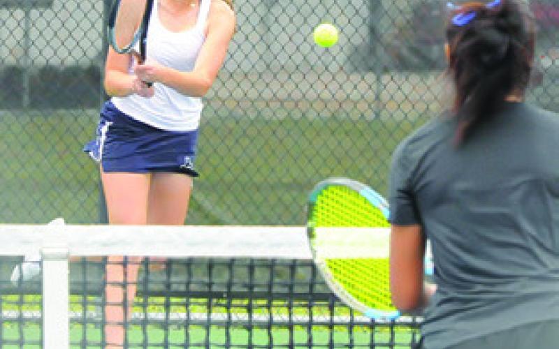 KYLIE VOGLER returns the ball during a mixed doubles match at the District 22-4A Tournament last week in Caldwell. She and Cayden Zboril won the mixed doubles title and qualified for the regional tournament.