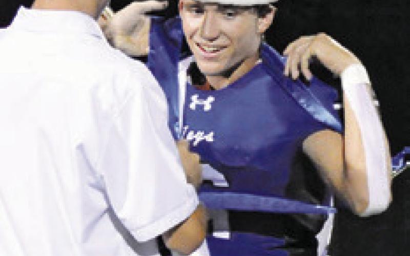 2023 HOMECOMING KING Josh Green crowns 2024 Homecoming King Brett Withem. Tribune photo by Denise Squier