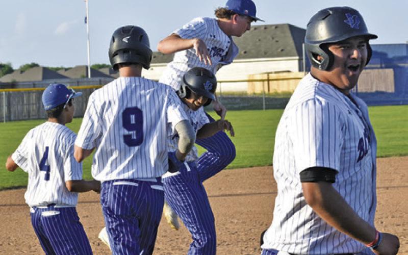 THE BLUEJAYS CELEBRATE defeating rival Somerville 6-5 in Game 1 of last Tuesday’s double-header and breaking into the win column for the first time this season. Tribune photo by Roy Sanders