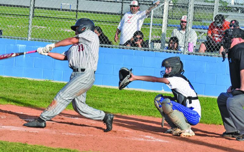 SOMERVILLE’S ULYSSES PEREZ hits the ball during the Yeguas’ game against the Bluejays in Snook last Tuesday afternoon.