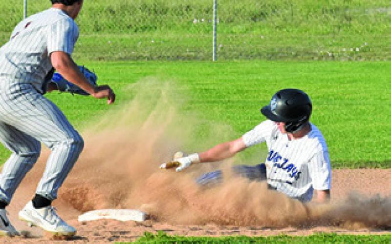 SNOOK’S GABE LACAZE slides into second as Somerville’s Greg Fowler approaches the bag during a Bluejay-Yegua game. Tribune photo by Roy Sanders