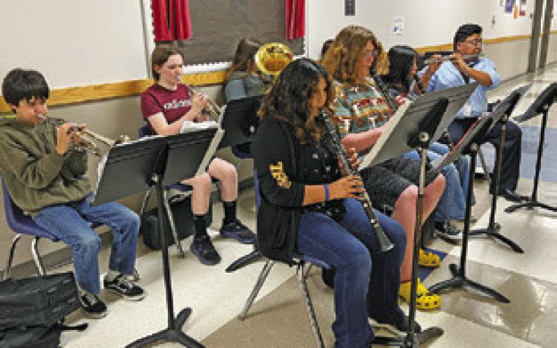THE SNOOK SECONDARY BAND performed during the March 24 Snook School Board Meeting. Tribune photo by Denise Squier