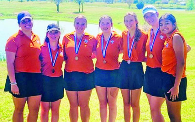 THE CALDWELL GIRLS team, taking third in Navasota, includes, from left, Kierstyn Macik, Brandy Gillar, Tanzley Johnson, Raeleigh Ussery, Madilyn Schneider, Alison Krueger and Patsy Pineda.