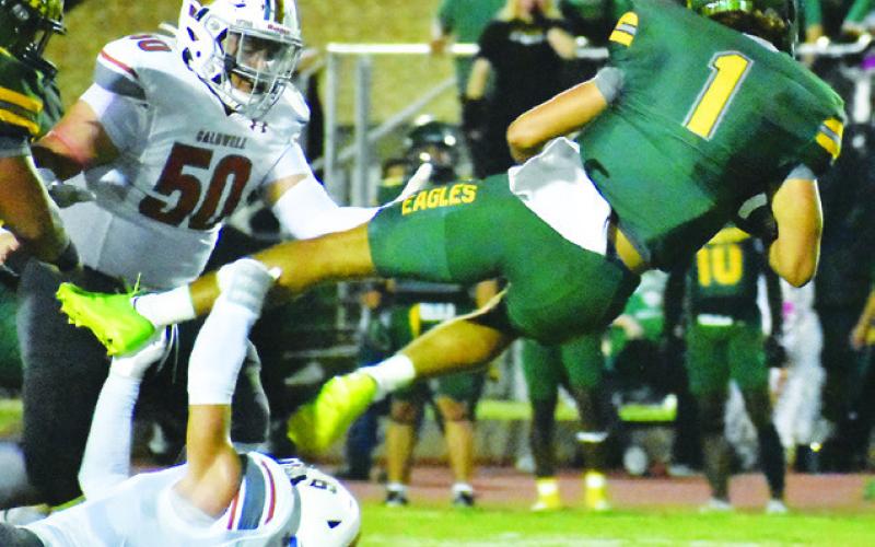 JAXON ANDERSON OF CALDWELL makes this tackle last Friday against Lexington in the Hornets’ final non-district game. Also pictured is Caldwell’s Davian Sanchez. Tribune photo by Roy Sanders