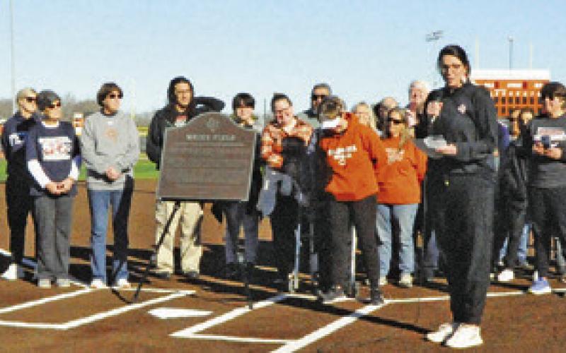 CALDWELL ASSISTANT ATHLETIC Director Jane Anne Giese gives the official dedication speech during Saturday’s ceremony renaming Lady Hornet Field to “Weiss Field.” Tribune photo by Denise Squier