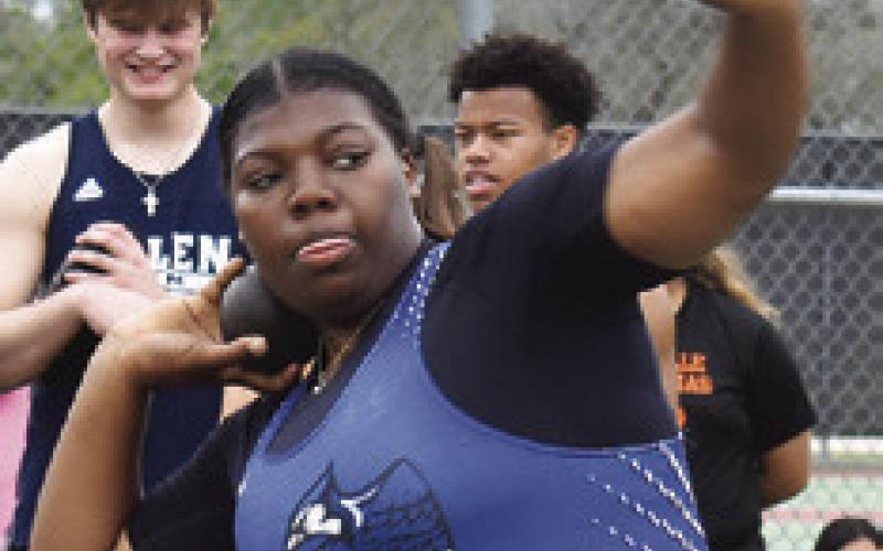 MIRACLE HILL sets to throw the shot put during last week’s Koppers Relays. She won the event with a toss of 35 feet 6.5 inches.