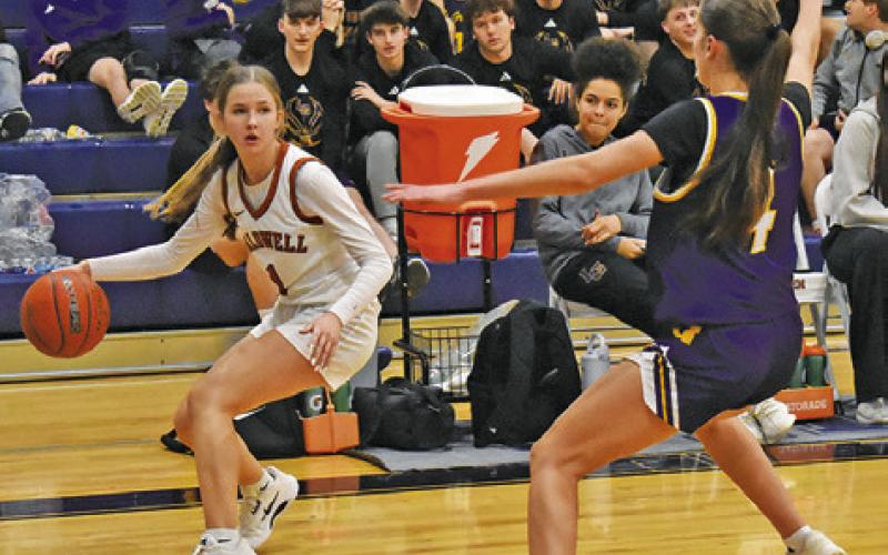 CALDWELL’S LYDIA HICKS tries to get help out of the corner of the court during the Lady Hornets’ game against La Grange on Friday. Tribune photo by Roy Sanders