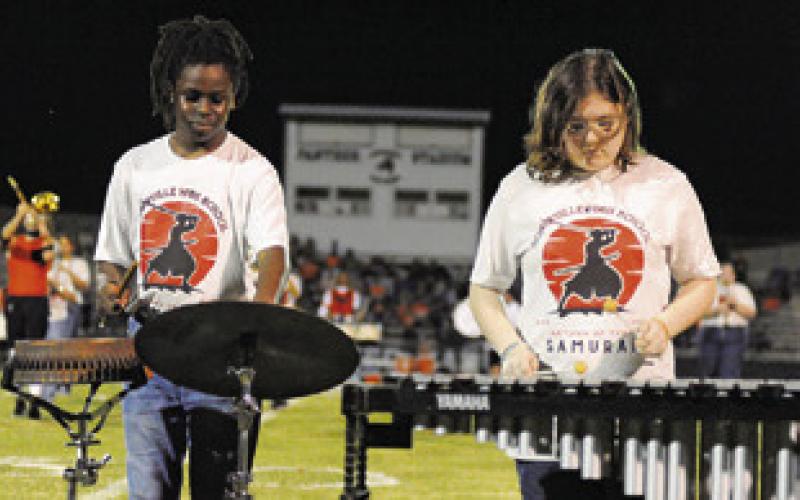 THE SOMERVILLE YEGUA BAND pit crew was featured during Friday night’s halftime show in Normangee. Pictured, from left, are Michael Nelson and Elora Sowders. Tribune photo by Denise Squier