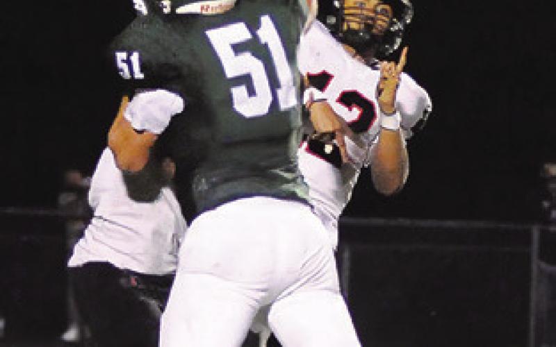 ANDY ESPINOZA hurls this pass against Normangee. Tribune photo by Denise Squier