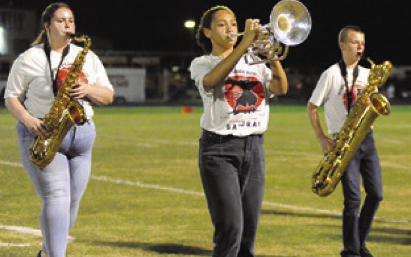 THE SOMERVILLE YEGUA BAND marched the first section of its UIL Marching Contest show Friday night in Normangee. Pictured, from left, are Kieleigh Connelly, Kaylee Gentry and Jaxson Schoppe. Tribune photo by Denise Squier