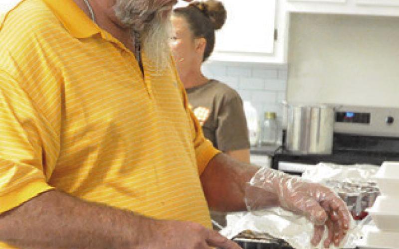 A TURKEY IS BEING carved at Caldwell Assembly’s Thanksgiving meal for the community on Thursday. Tribune photo by Denise Squier