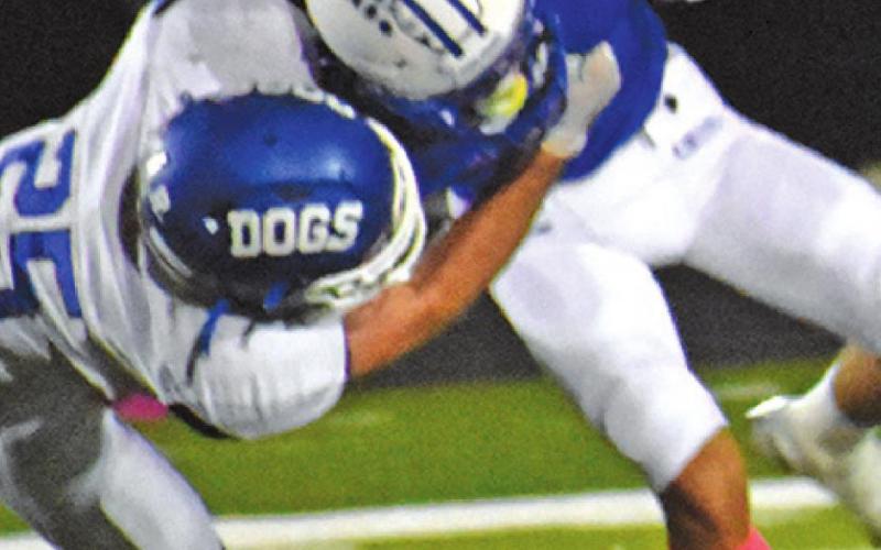 JOSE GARCIA OF Snook makes a catch against Bartlett. The Bluejays won 56-8.