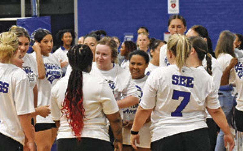SNOOK LADY JAY ALUMNI prepare strategy for taking on the current Lady Jays last Friday. Tribune photo by Roy Sanders