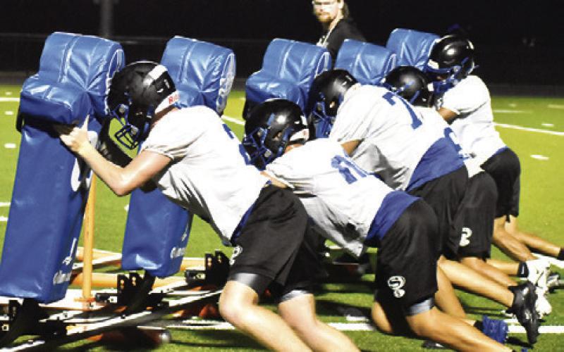 SNOOK’S LINEMEN WORK on this drill during last Friday night’s practice at Bluejay Stadium. Tribune photo by Roy Sanders