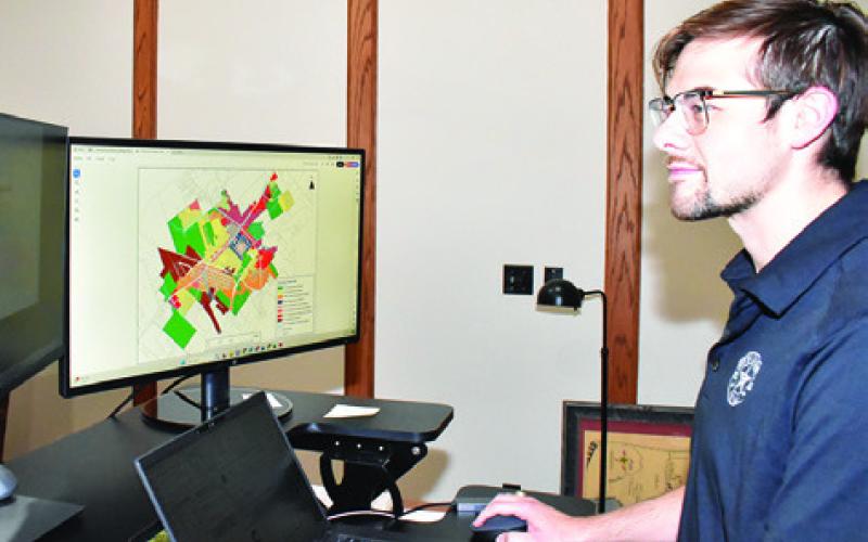 FORREST WILLIAMS LOOKS at this computer map at city hall.