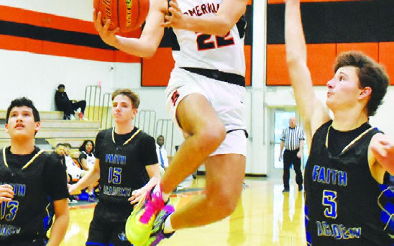 GAVIN WILLIAMS OF Somerville leaps high for this shot against Bellville Faith Academy. -- Tribune photo by Roy Sanders