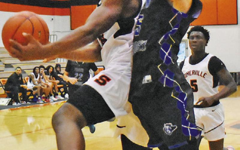 KEKE DANIELS TAKES a shot against Bellville Faith Academy at the Koppers Tournament. -- Tribune photo by Roy Sanders