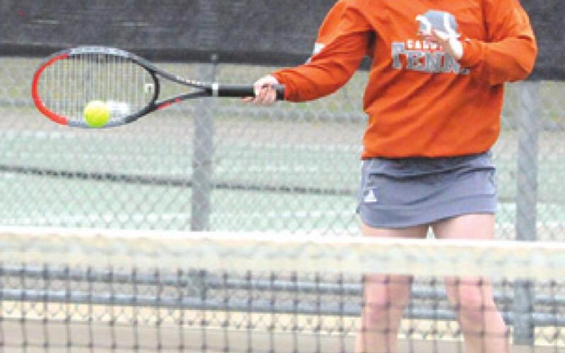 HOPE SAVAGE RETURNS the ball during a girls’ doubles match Friday at Rudder High in Bryan. -- Tribune photo by Denise Squier