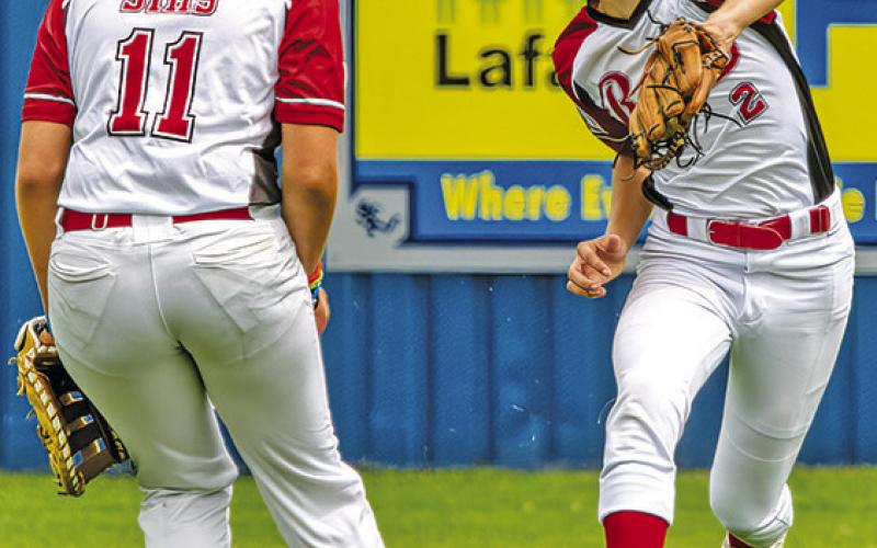 BAYLIN PARKER catches a ball during a Deanville Reds baseball game at the Pony League’s Zone Tournament in Youngsville, Louisiana. Also pictured is Ajryan Sims. The 14U team went 1-2 in tournament play. Ford 2 0 2 0 0 0 Olivera 200 0 1 0 Sanchez 2 00 1 1 0 LaSeur 200 0 0 0 Fritsch 200 0 0 0 Hildebrand2 01 0 0 1 Sims 2 0 1 0 0 1 Elkins 2000 01 Parker 1000 01 Smith 1 11 0 0 0 Pitcher: IP H R ER BB K Hildebrand 3.1 2 3 1 4 5 Elkins 1.0 1 1 1 0 2