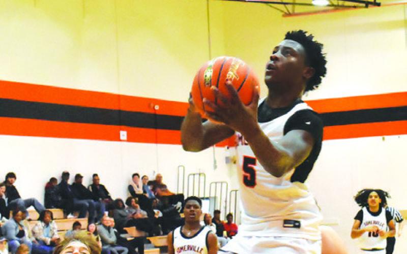 KEITH CRAWFORD OF Somerville moves in for a shot against Weimar. Somerville won 53-37. -- Tribune photo by Roy Sanders