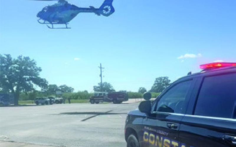 A HELICOPTER takes off on Monday, July 27, to transport this assault victim from Somerville to a Temple hospital. Photo courtesy of Pct. 4 Constable’s Office