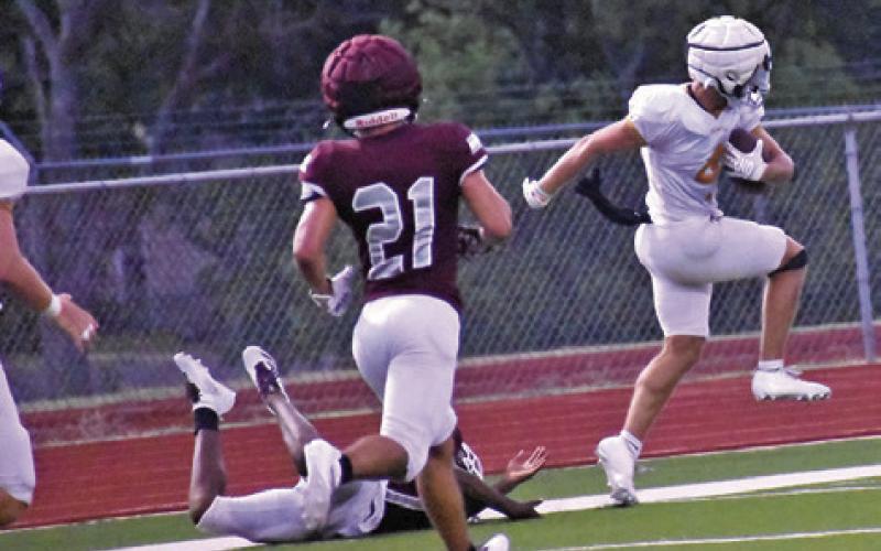 COY BECKA SCORES a touchdown for Caldwell against Troy in the scrimmage last Thursday. Tribune photo by Roy Sanders
