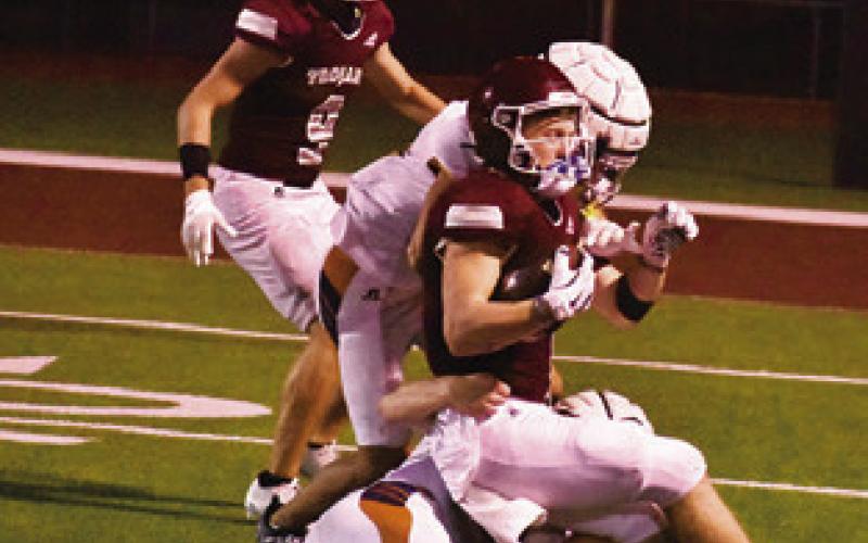 THE HORNET defense tackles this Troy ball carrier.