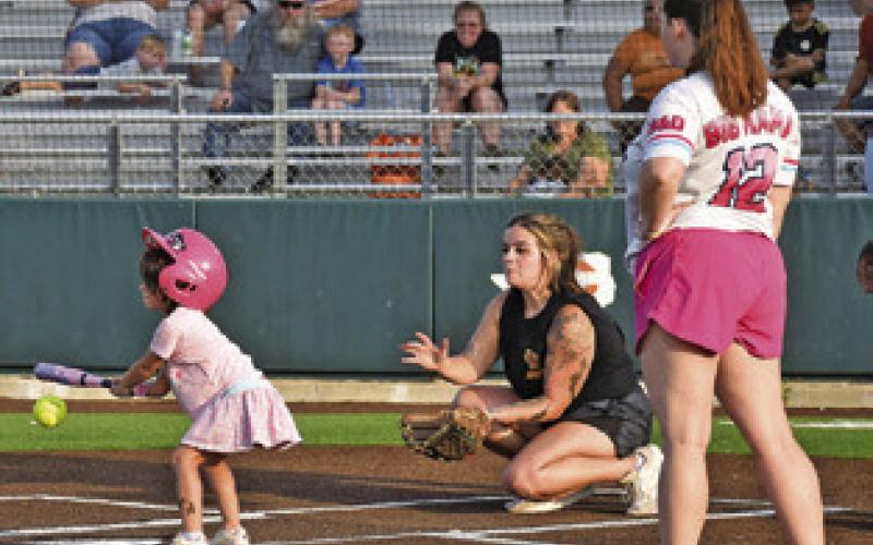 A BATTER GETS encouragement during this Sandlot Slow Pitch Softball game as part of National Night Out in Caldwell. Tribune photo by Roy Sanders