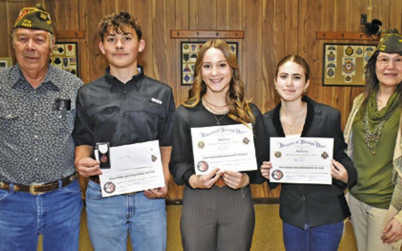 THE VFW PATRIOT’S PEN Award winners included, from left, Clayton Fraley, third place, Kelsey Becka, first place, and Mikaela Handy, second place. Joining them are Tommy Miles and Tina Smith of the Caldwell VFW Post No. 4458.