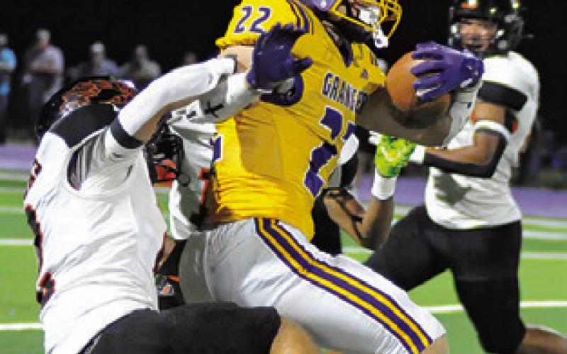 COLT HOLTON of Somerville tackles this Granger ball carrier last Friday. Tribune photo by Denise Squier