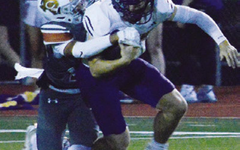 GUS NAQUIN of Caldwell makes a tackle against La Grange last Friday in Caldwell. Tribune photo by Kim Hutcheson