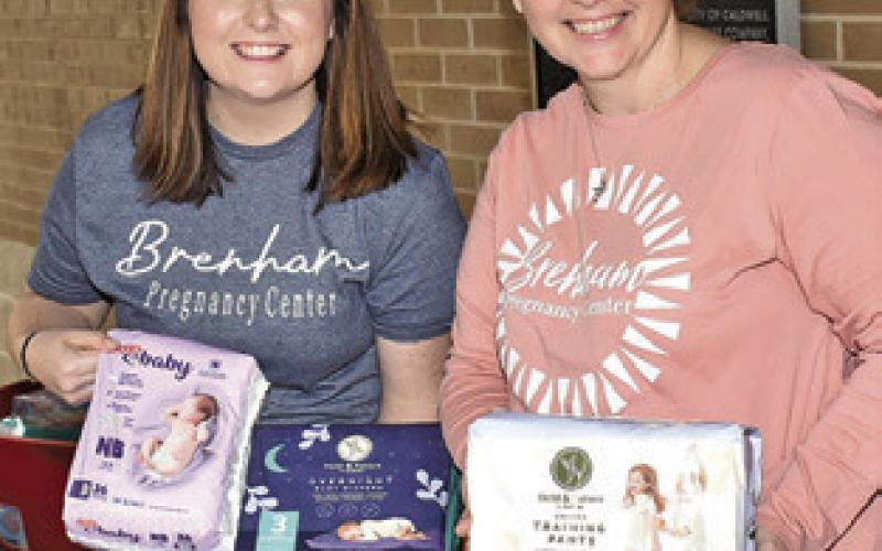 KATLYN MARBURGER and Amy Banik of the Brenham Pregnancy Center provide these free diapers and baby supplies at the car seat and booster seat inspection last Friday.