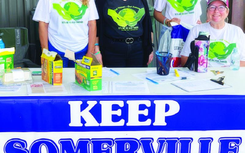 MELISSA YOUNG, KATHY Pollock, Norma Medina and Fran Pack work on Saturday during the city-wide cleanup effort.