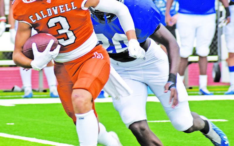 CALDWELL’S KOY Becka carries the ball against Navasota in the scrimmage.