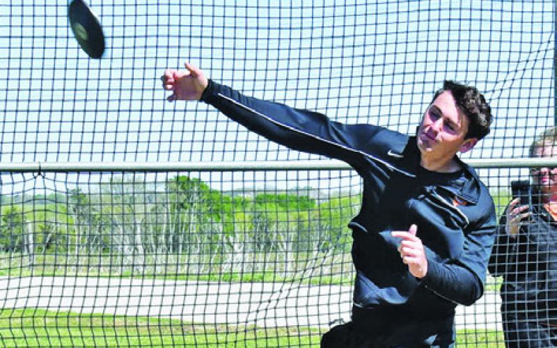 CALDWELL’S JOHN FRYREAR tosses the discus at last week’s Happy Skrabanek Relays at Caldwell High School. Tribune photo by Roy Sanders
