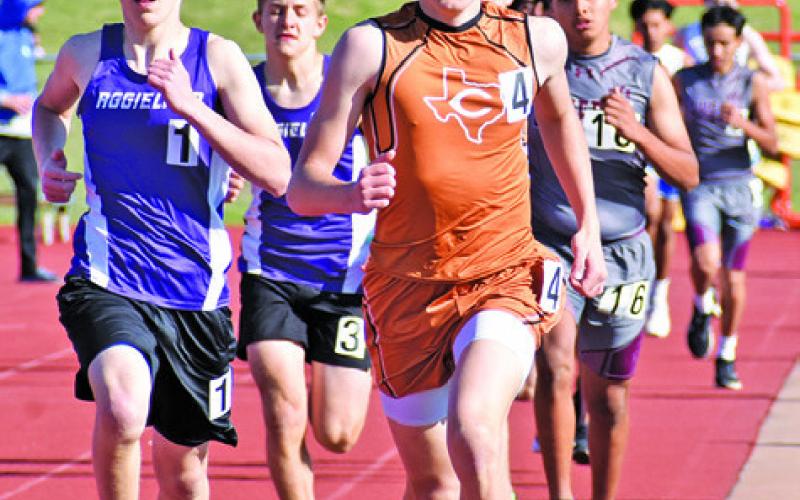 CALDWELL’S TYLER MUZNY runs with the pack at last week’s Happy Skrabanek Relays at Hornet Stadium. Tribune photo by Roy Sanders