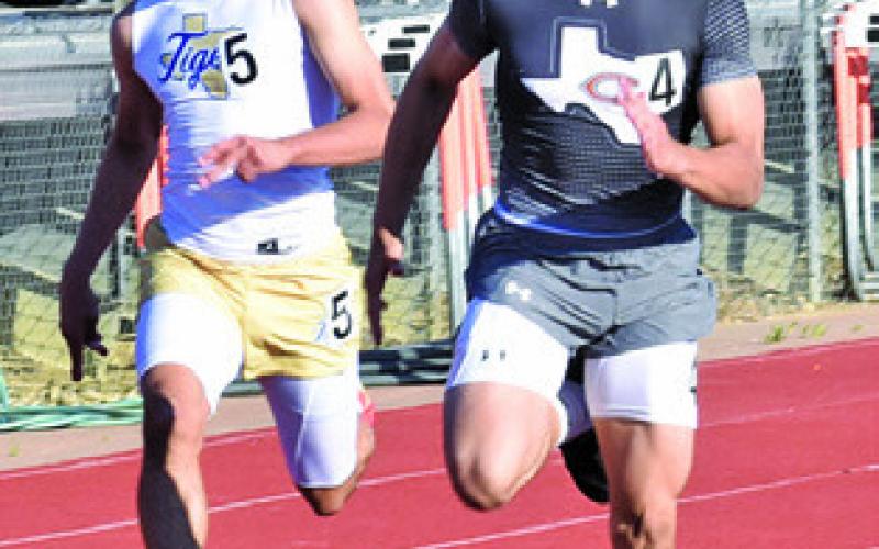 KORBIN BURNS sprints towards the finish line during the Happy Skrabanek Relays. Tribune photo by Roy Sanders