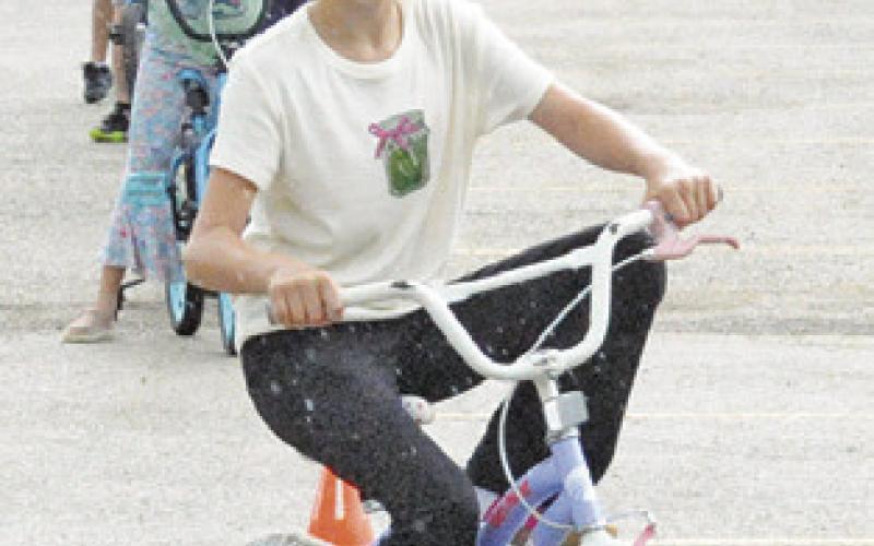 BIKE RIDERS showed off their riding skills during Friday’s bicycle rodeo, sponsored by Texas A&amp;amp;M AgriLife Extension. Tribune photo by Denise Squier